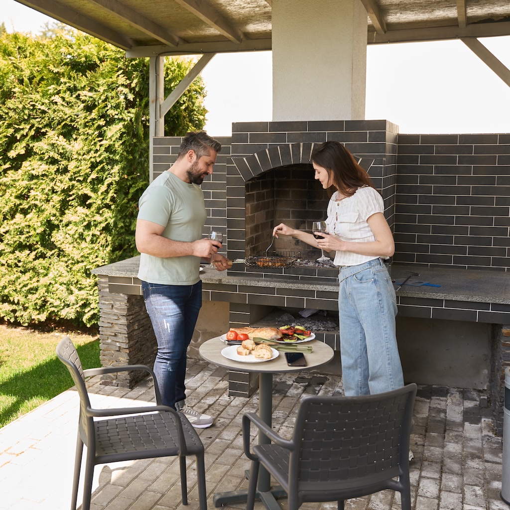 spouses-cook-food-together-in-the-backyard-2025-03-08-12-36-26-utc